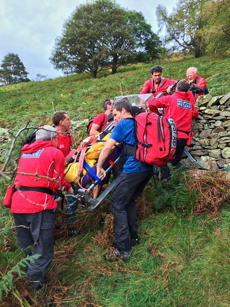 Rescuers stretcher the injured walker down from the fell. Photo: Keswick MRT Rescuers stretcher the injured walker down from the fell. Photo: Keswick MRT