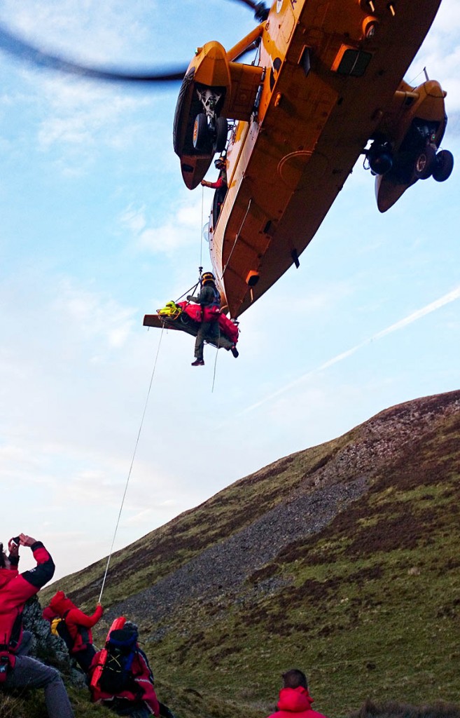 The injured walker is winched into the Sea King from Trusmadoor. Photo: Keswick MRT The injured walker is winched into the Sea King from Trusmadoor. Photo: Keswick MRT