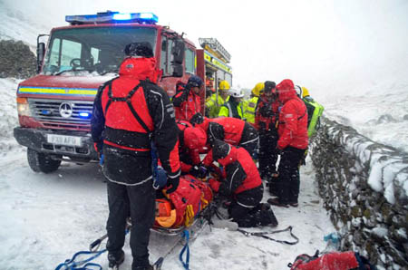 Mountain rescuers work with the emergency services at the scene on the Kirkstone Pass. Photo: Langdale Ambleside MRT
