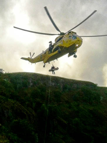 The injured woman is winched into the RAF Sea King The injured woman is winched into the RAF Sea King