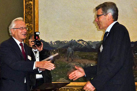 Mick Fowler, right, receives his award from foundation president Mick Fowler, right, receives his award from foundation president