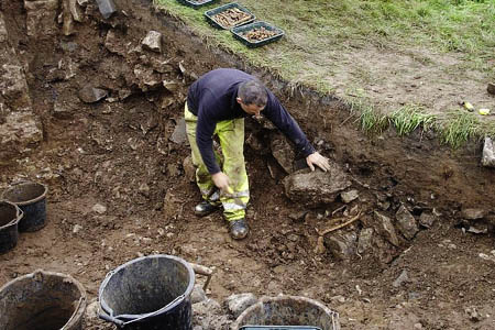 Dr Clive Waddington of Archaeological Research Services with the skeleton unearthed in the Peak District