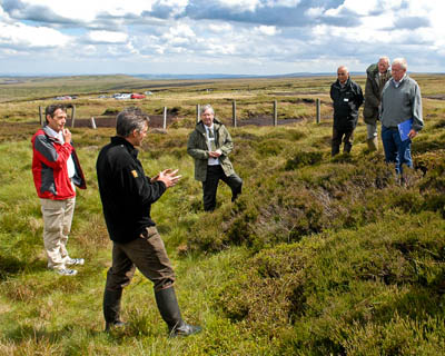 Moors for the Future staff explain the MoorLIFE project to Poul Christensen, chair of Natural England, and Peak District National Park Authority leaders