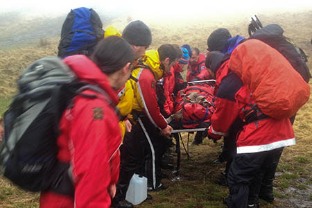 Rescuers prepare to stretcher the injured walker from the Neuadd Ridge. Photo: Ryan Atkinson Rescuers prepare to stretcher the injured walker from the Neuadd Ridge. Photo: Ryan Atkinson