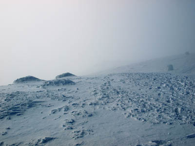 The scene on Ben Nevis's summit, where heavy snow accumulations have virtually buried some of the cairns