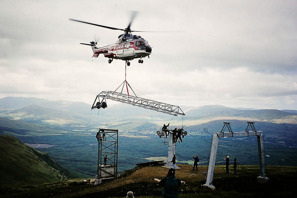 A helicopter airlifts parts in during construction of the resort A helicopter airlifts parts in during construction of the resort