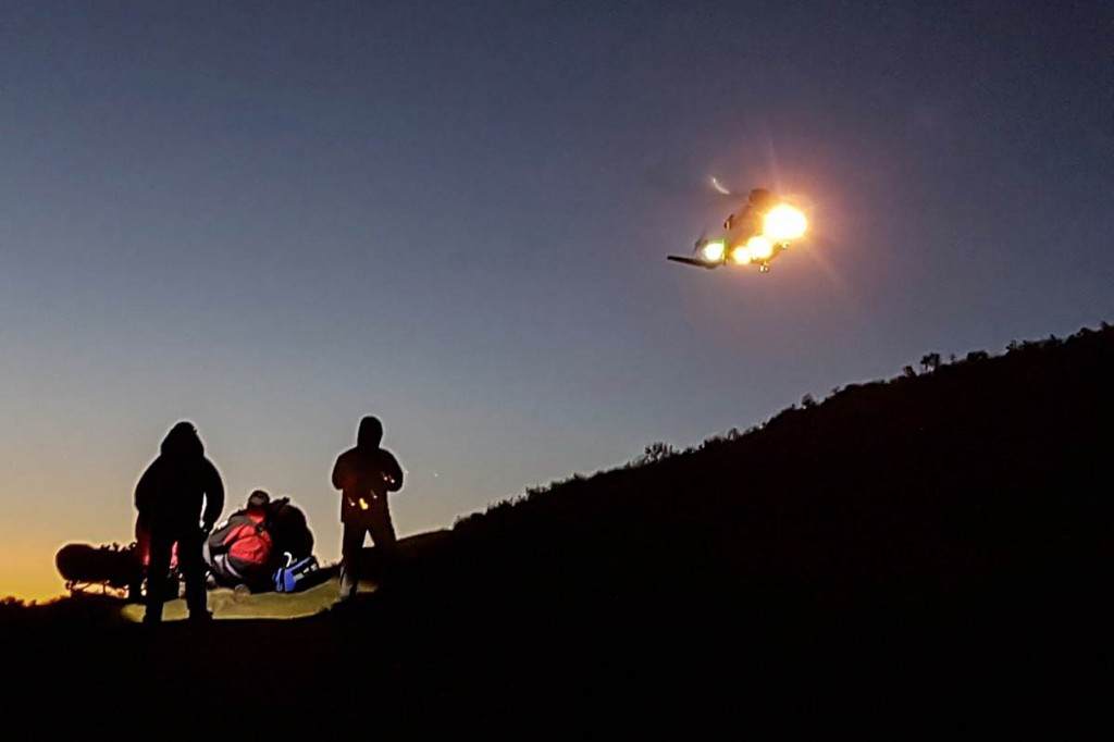 The Coastguard helicopter at the scene. Photo: Newsar The Coastguard helicopter at the scene. Photo: Newsar