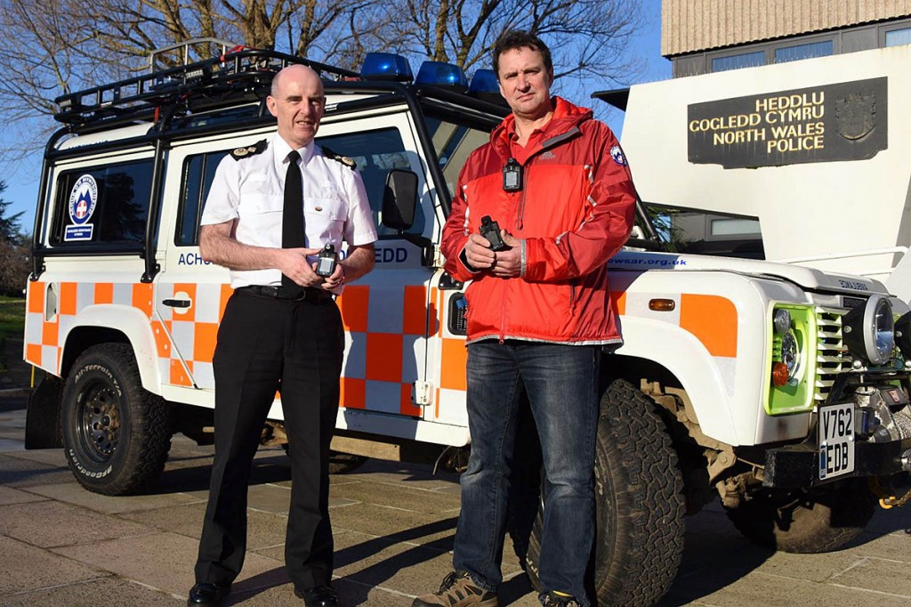 DCC Gareth Pritchard hands the cameras to one of the association's representatives. Photo: North Wales Police