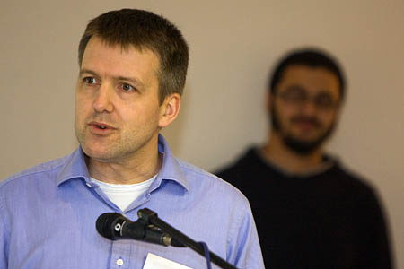 Adnan Zaman listens as Andy Robinson addresses delegates Adnan Zaman listens as Andy Robinson addresses delegates
