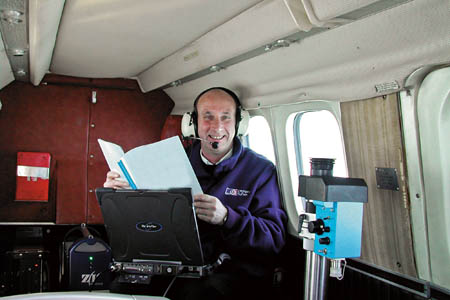 John McGrandle, an Ordnance Survey digital camera operator on one of the agency's planes John McGrandle, an Ordnance Survey digital camera operator on one of the agency's planes
