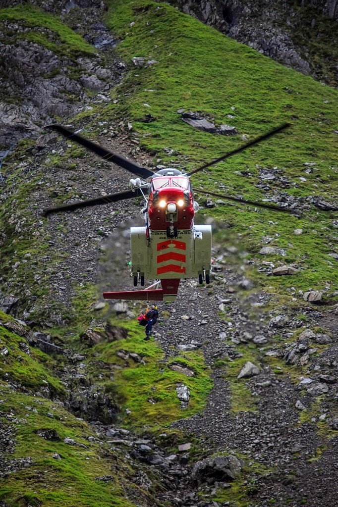 The woman is winched into the Coastguard helicopter in Cwm Idwal. Photo: John Carrie The woman is winched into the Coastguard helicopter in Cwm Idwal. Photo: John Carrie