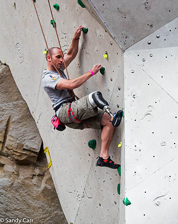 Stuart Sneddon climbing at the Edinburgh competition. Photo: Sandy Carr Stuart Sneddon climbing at the Edinburgh competition. Photo: Sandy Carr