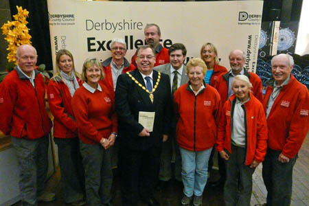 Peak District national park volunteer rangers' representatives receive their Excellence in the Community Award from Derbyshire County Council leaders: from left, Terry Page, Rose Clarke, Andrea Pedley, Neville Sparrow, Councillor George Wharmby, Nick Robinson, Councillor Andrew Lewer, Jean Cullen, Kathie Cutter, Frank Milner, Margaret Black and Eric Wood Peak District national park volunteer rangers' representatives receive their Excellence in the Community Award from Derbyshire County Council leaders: from left, Terry Page, Rose Clarke, Andrea Pedley, Neville Sparrow, Councillor George Wharmby, Nick Robinson, Councillor Andrew Lewer, Jean Cullen, Kathie Cutter, Frank Milner, Margaret Black and Eric Wood