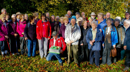 Peak Park Leisure Walkers celebrate their 20th anniversary with a specially decorated cake. Flanking the cake, on the left is leisure walks co-ordinator Christina Porter, and on the right, oldest walker 98-year-old Charles Harvey Peak Park Leisure Walkers celebrate their 20th anniversary with a specially decorated cake. Flanking the cake, on the left is leisure walks co-ordinator Christina Porter, and on the right, oldest walker 98-year-old Charles Harvey.