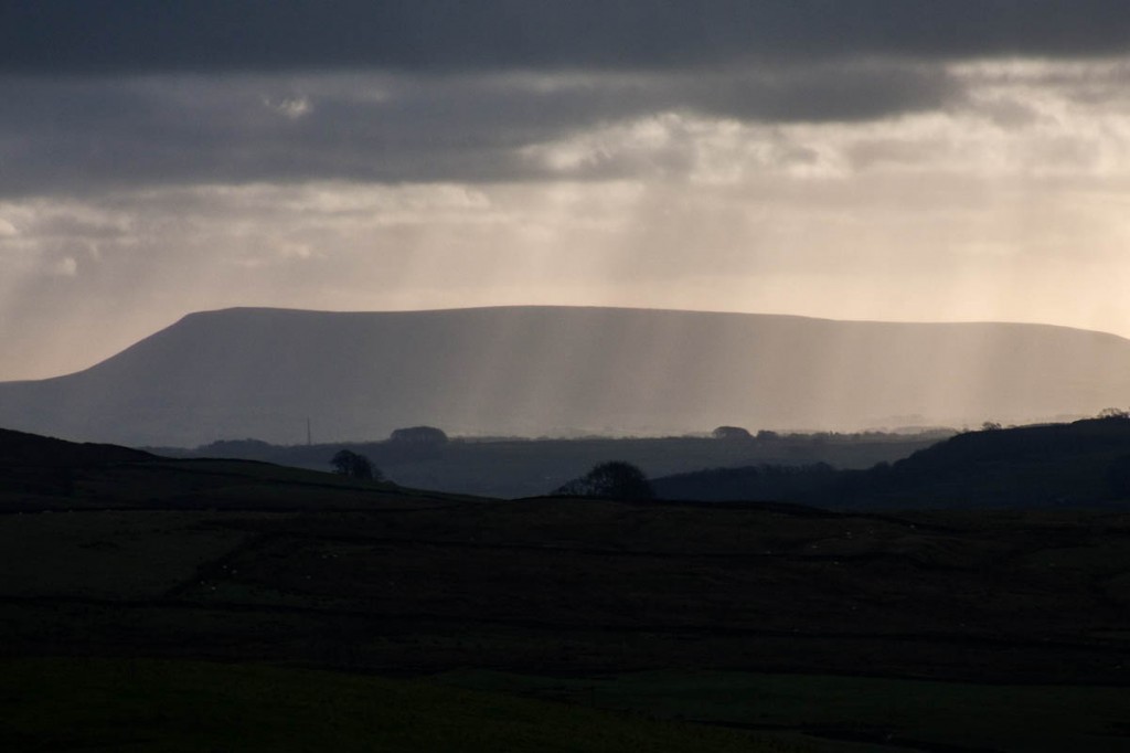 Pendle Hill's bulky profile dominates the Ribble Valley Pendle Hill's bulky profile dominates the Ribble Valley