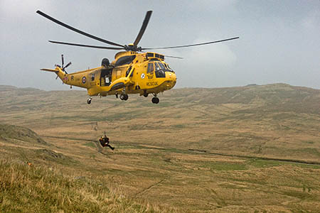 The RAF Sea King winches the injured walker on the route between Mosedale Cottage and Swindale Head. Photo: Paul Tomkinson