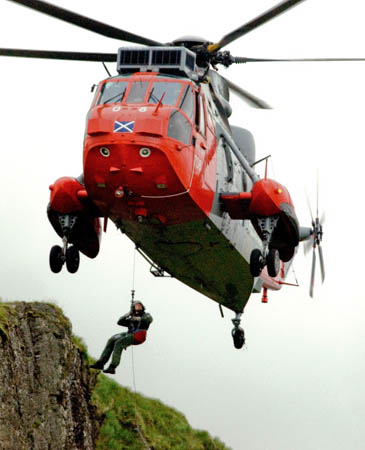 A Royal Navy Sea King in action. Downdraft will whip up loose items