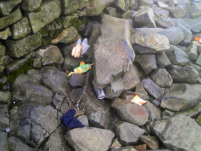Rubbish on the mountain's summit in pictures taken by Mr Cook