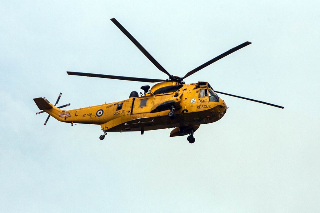 An RAF Sea King flew the man to hospital in Swansea