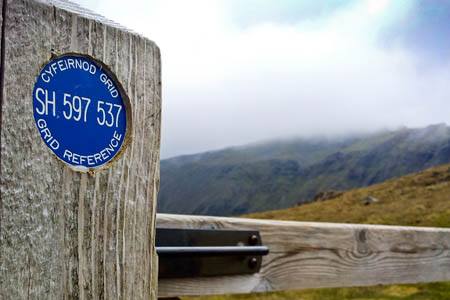 The plaques are fixed to gates and stiles and bear the location's grid reference. Photo: Snowdonia NPA