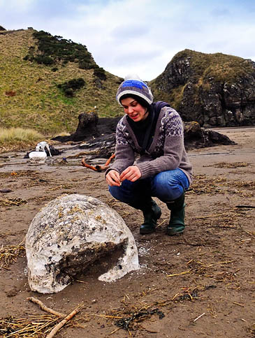 Volunteer Lainey Rees with one of the lumps of lard. Photo: SNH