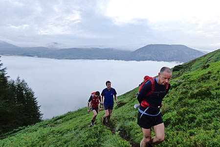 Steve Birkinshaw, centre, rises above a temperature inversion with two support runners Steve Birkinshaw, centre, rises above a temperature inversion with two support runners