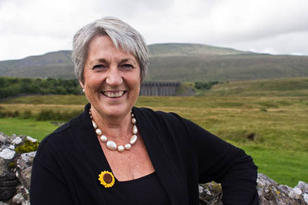 Angela Baker, with Whernside behind her