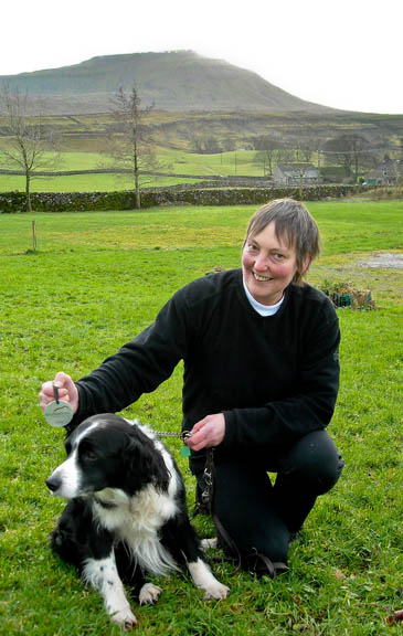 Morris with owner Sabena Martin and the dog's favourite fell Ingleborough in the background. Photo: Yorkshire Dales National Park Authority