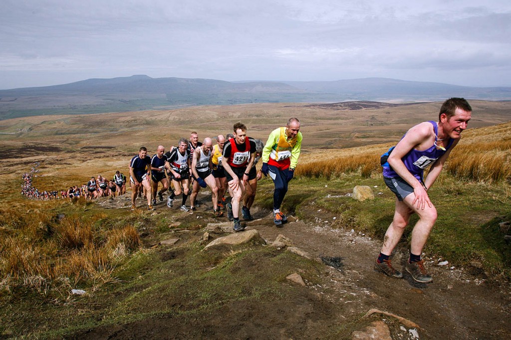 Runners ascend Pen-y-ghent in a previous race, with Ingleborough and Whernside in the distance Runners ascend Pen-y-ghent in a previous race, with Ingleborough and Whernside in the distance
