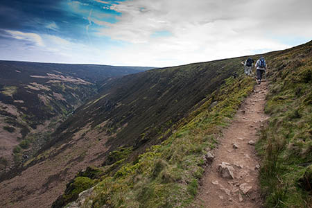 The walker became exhausted on the Pennine Way at Clough Edge, Torside Clough The walker became exhausted on the Pennine Way at Clough Edge, Torside Clough