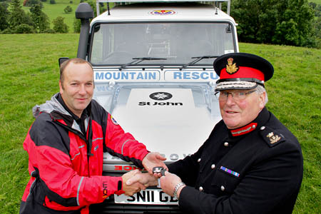 Captain Younger hands over the keys. Photo: Jason Baxter Captain Younger hands over the keys. Photo: The new Land Rover, left, with the one bought last year. Photo: Jason Baxter