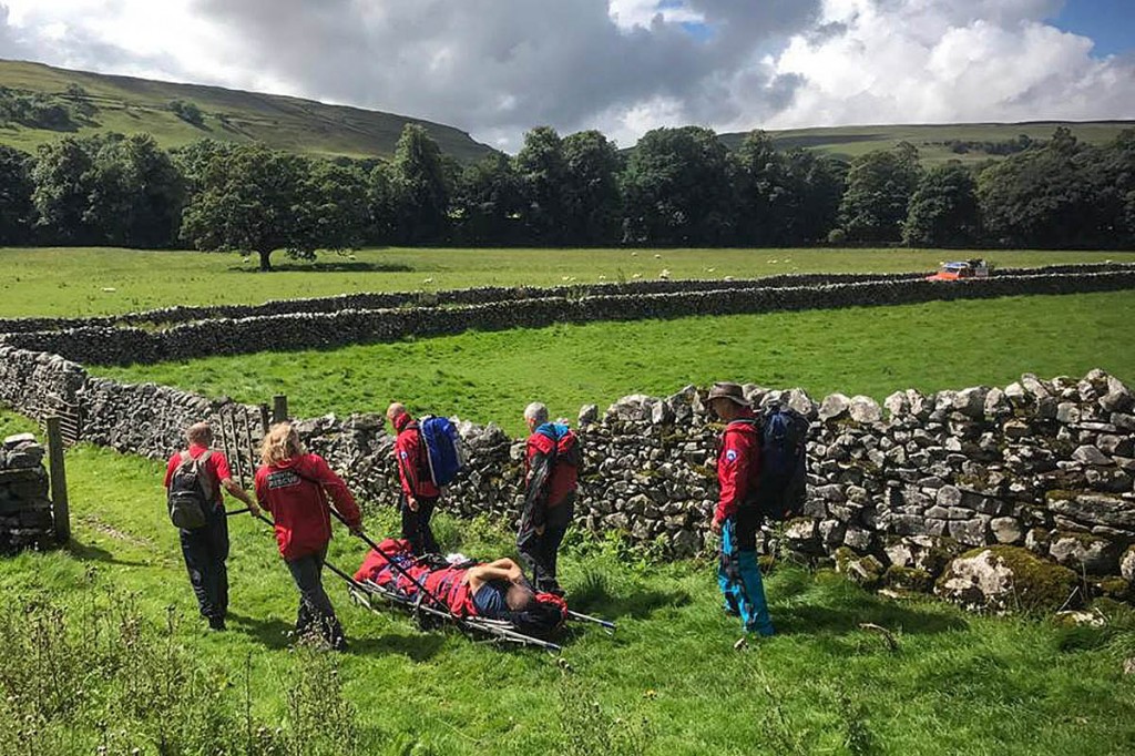Mr Sugden is sledged down the fellside to a waiting ambulance. Photo: UWFRA Mr Sugden is sledged down the fellside to a waiting ambulance. Photo: UWFRA
