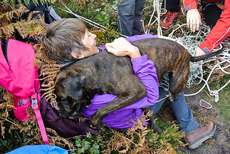 The happy boxer is reunited with her owner. Photo: UWFRA The happy boxer is reunited with her owner. Photo: UWFRA