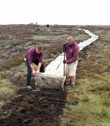 Laying a path across the South Pennine moors as part of the project Laying a path across the South Pennine moors as part of the project