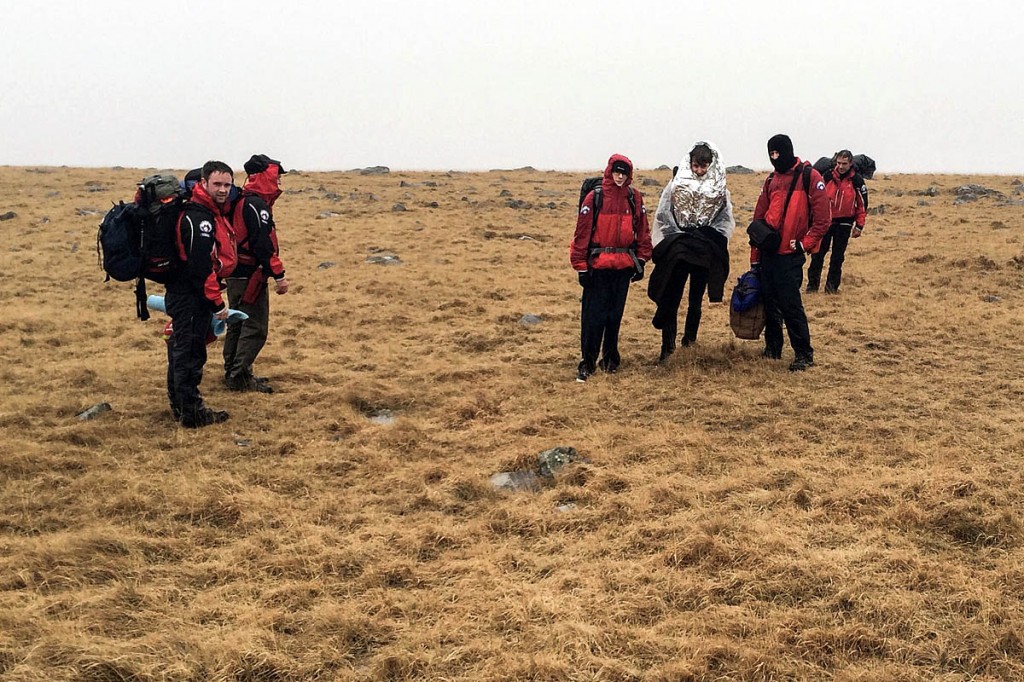 Western Beacons members with the rescued men. Photo: Western Beacons MSRT