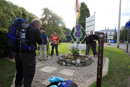Walkers celebrate completion of the West Highland Way at its old finishing point