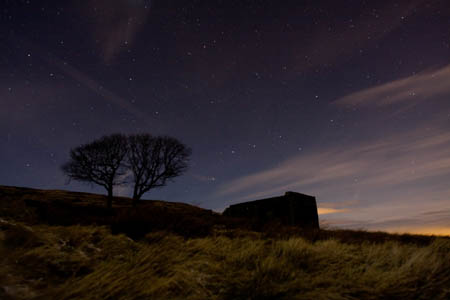 Top Withens by night. The ruin is passed by walkers on the Pennine Way national trail