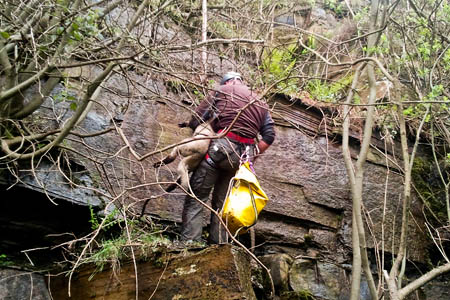A team member rescues the lamb. Photo: Woodhead MRT A team member rescues the lamb. Photo: Woodhead MRT