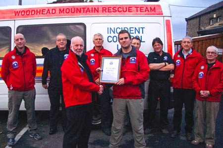 Mike France, centre left, receives his 40-year-service award from team leader Keith Wakeley Mike France, centre left, receives his 40-year-service award from team leader Keith Wakeley