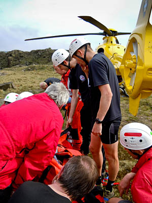Rescue teams treat the man Rescue teams treat the man