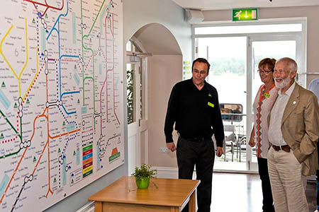 Ambleside manager Peter Brendling joins Sir Chris and Caroline White as they look at a giant Tubular Fells map in the refurbished hostel Ambleside manager Peter Brendling joins Sir Chris and Caroline White as they look at a giant Tubular Fells map in the refurbished hostel